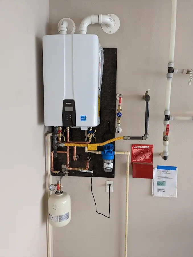 Professional plumber installing copper piping in a Fishhook home